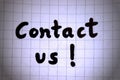 Contact us text hand written on paper