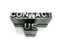 Contact us in vintage letterpress blocks Royalty Free Stock Photo