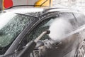 Contactless  car wash self service system. Washing dirty car in car wash station with foam Royalty Free Stock Photo