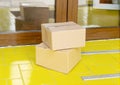 Contactless delivery. Safe shopping delivering to home. Food box on doorstep. E-commerce purchase delivered parcels at home. Boxes Royalty Free Stock Photo