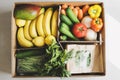 Fresh fruits, herbs and vegetables in a paper box