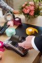 Contactless payment in flower shop Royalty Free Stock Photo