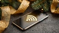 Contactless payment symbol glows on smartphone among festive decor and greenery Royalty Free Stock Photo