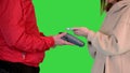 Contactless paypass using smartphone and electronic payment terminal on a Green Screen, Chroma Key.
