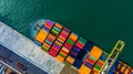 Container cargo freight ship with working crane bridge discharge at container terminal, Aerial top view container ship at deep sea Royalty Free Stock Photo