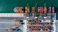 Container cargo freight ship with working crane bridge discharge at container terminal, Aerial top view container ship at deep sea Royalty Free Stock Photo