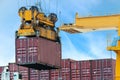 Container Cargo freight ship with working crane loading bridge i