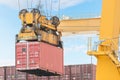 Container Cargo freight ship with working crane loading bridge i