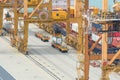 Container Cargo freight ship with working crane loading bridge i Royalty Free Stock Photo