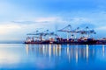 Container Cargo port freight ship with working crane bridge in s Royalty Free Stock Photo