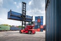 Container Cargo Port Ship Yard Storage of Logistic Transportation Industry. Forklift is Stacking Containers of Freight Import/ Royalty Free Stock Photo