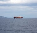 Container cargo ship full loaded is sailing in open sea background. Import export, water transport Royalty Free Stock Photo