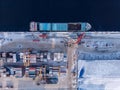 Container cargo ship loading North Arctic port. Concept freight transportation import export and business logistic Royalty Free Stock Photo