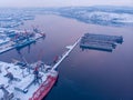 Container cargo ship loading North Arctic port. Concept freight transportation import export and business logistic Royalty Free Stock Photo