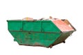 Container for construction waste with broken bricks on the background of a multi-storey building Royalty Free Stock Photo