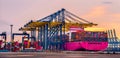 Container crane cargo freight ship with working crane loading bridge containers in shipyard at dock yard for logistic import and e Royalty Free Stock Photo