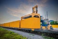 Container crane cargo freight ship with working crane loading bridge containers in shipyard at dock yard for logistic import and e Royalty Free Stock Photo