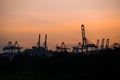 Container cranes at Singapore Cargo Terminals at sunset Royalty Free Stock Photo