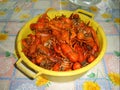 Container with crayfish after cooking, ready to eat . The color of the chitinous cover turned red.