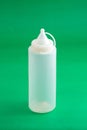Container Dispenser Plastic Sauce; Photo On Green Background Royalty Free Stock Photo