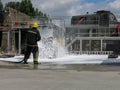 Container fire fighting training. Fire fighter spraying non aspirated foam
