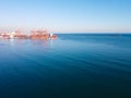 Container gantry cranes at port. Sea cargo logistics terminal. Landscape with copy space Royalty Free Stock Photo