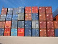 Groupm of containers stacked on pile Royalty Free Stock Photo