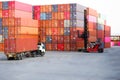 Container handlers and trucks In the loading and unloading yard Royalty Free Stock Photo