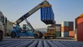 Container handling process with a telescopic container crane on logistics platforms Royalty Free Stock Photo