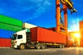 Container handling. Container truck picking up container at yard. Port logistics, container yard operation Royalty Free Stock Photo