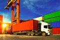 Container handling. Container truck picking up container at yard. Port logistics, container yard operation Royalty Free Stock Photo