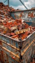 Container loaded with red bricks and debris from a demolished building at a site Royalty Free Stock Photo