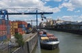 Container loading with a blue container handling portal crane in the osthafen