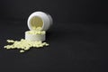 Baby Aspirin spilled out in front of their container Royalty Free Stock Photo