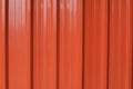 Container metal orange wall texture background. Color panel red-orange color building facade. Royalty Free Stock Photo