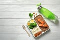 Container with natural healthy lunch, bottle of water and space for text on table, top view. High protein food Royalty Free Stock Photo