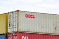 Container of OOCL (Orient Overseas Container Line Limited) company with goods ready to be transported at terminal