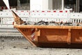 Container, orange skip for construction waste standing on the road, road construction work, construction site Royalty Free Stock Photo