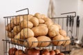 Container with potatoes and onions. Orderly storage Royalty Free Stock Photo