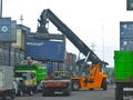 Container reach stacker in action stock photo