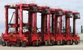 Container reach stacker moving containers around at Southampton docks UK