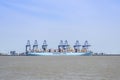 A container ship being unloaded.