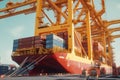 Container ship at the berth in cargo terminal of the port under loading. Port cranes load containers, place them on the Royalty Free Stock Photo