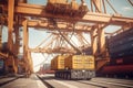 Container ship at the berth in cargo terminal of the port under loading. Port cranes load containers, a special vehicle