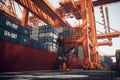 Container ship at the berth in cargo terminal of the port under loading. Port cranes load containers, place them on the