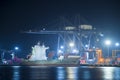 Container ship is berthing with cargo operation at night