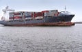 Container ship, cargo ship in winter, Baltic sea canal