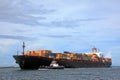 A container ship carrying colorful containers.