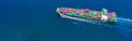 Container ship carrying container for import and export, business logistic and transportation by ship in open sea, Aerial view Royalty Free Stock Photo