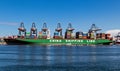 Container ship from China Shipping Line being loaded by gantry cranes in the Maasvlakte in the Port of Rotterdam, The Netherlands